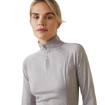 An image of a female model wearing the Ariat Sunstopper 2.0 1/4 Zip Baselayer in the colour Silver Sconce Dot.