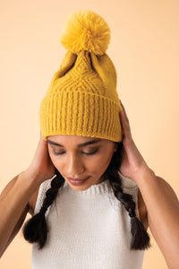 An image of the Powder Ingrid Pom Pom Hat