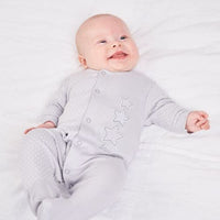 An image of the Dandelion Clothing Stars Sleepsuit
